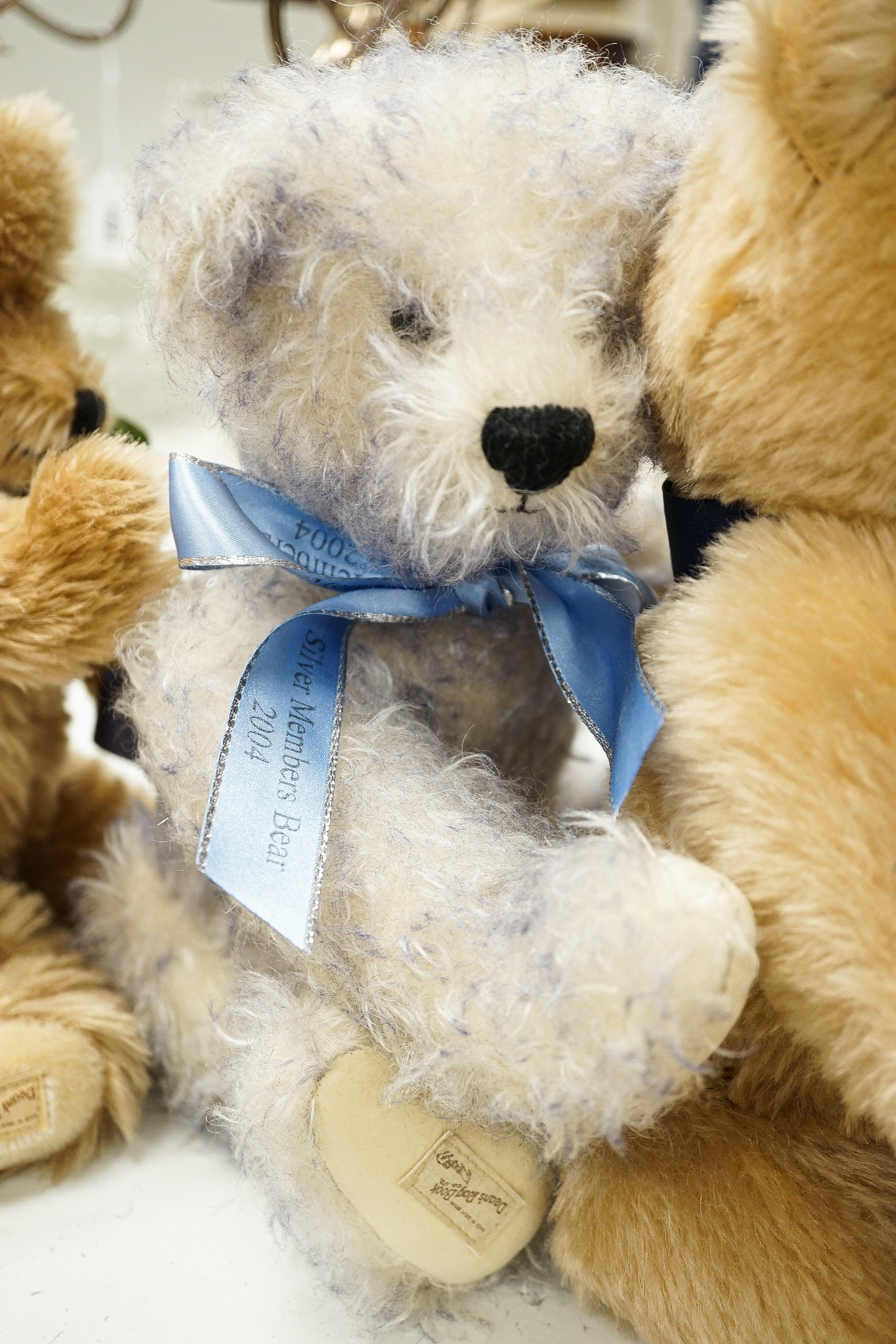 Four Deans teddy bears, a Steiff teddy and a Hermann teddy, Steiff bear, 39 cms high.